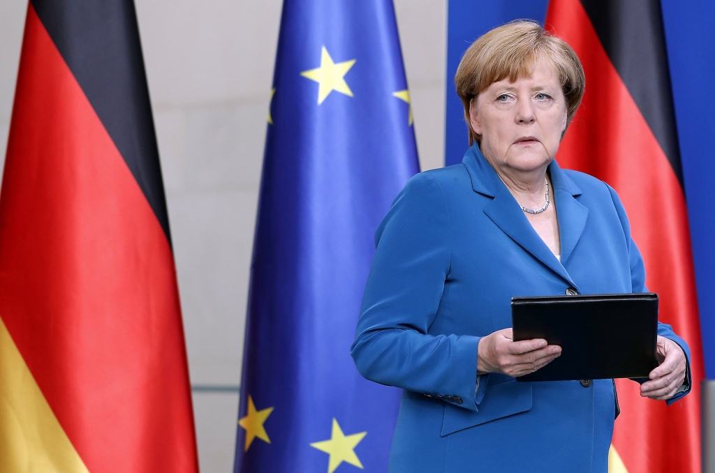 German Chancellor Angela Merkel arrives for a statement on the Munich attack in Berlin. Who's to blame for socks with holes and empty beer glasses? Angela Merkel according to a Facebook page set