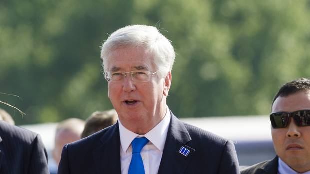 Michael Fallon arrives at the meeting of countries fighting IS