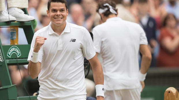 Milos Raonic celebrates winning his Wimbledon semifinal match against Roger Federer on Friday in London. Susan Mullane  USA Today Sports