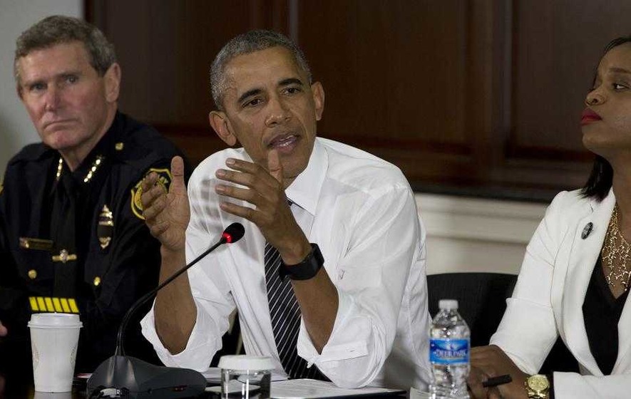 Barack Obama says police and communities not even close to resolving issues