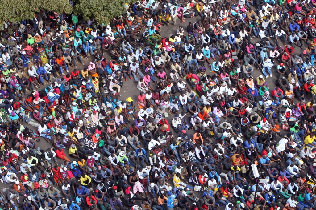 Thousands of Mugabe supporters gather at the party headquarters in Harare Wednesday July 20 2016. Tens of thousands of supporters of Zimbabwe's ruling party are marching in the capital in response to a series of recent protests against the govern