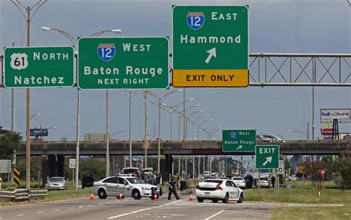 Baton Rouge police block Airline Highway after police were shot in Baton Rouge La. Sunday. Authorities in Louisiana say several law enforcement officers are dead and several injured in Baton Rouge after on-duty law enforcement officers were shot on Sun