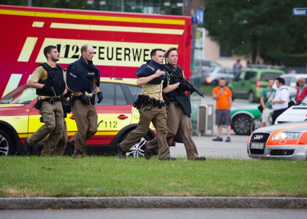 Policemen arrive at a shopping centre in which a shooting was reported in Munich southern Germany Friday