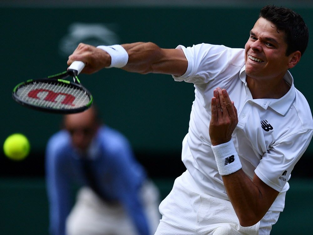 Canada's Milos Raonic returns to Britain's Andy Murray during the men's singles final match on the last day of the 2016 Wimbledon Championships at The All England Lawn Tennis Club in Wimbledon southwest London