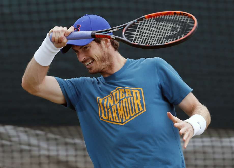 Andy Murray of Britain plays a shot ahead of the Wimbledon Tennis Championships in London Sunday