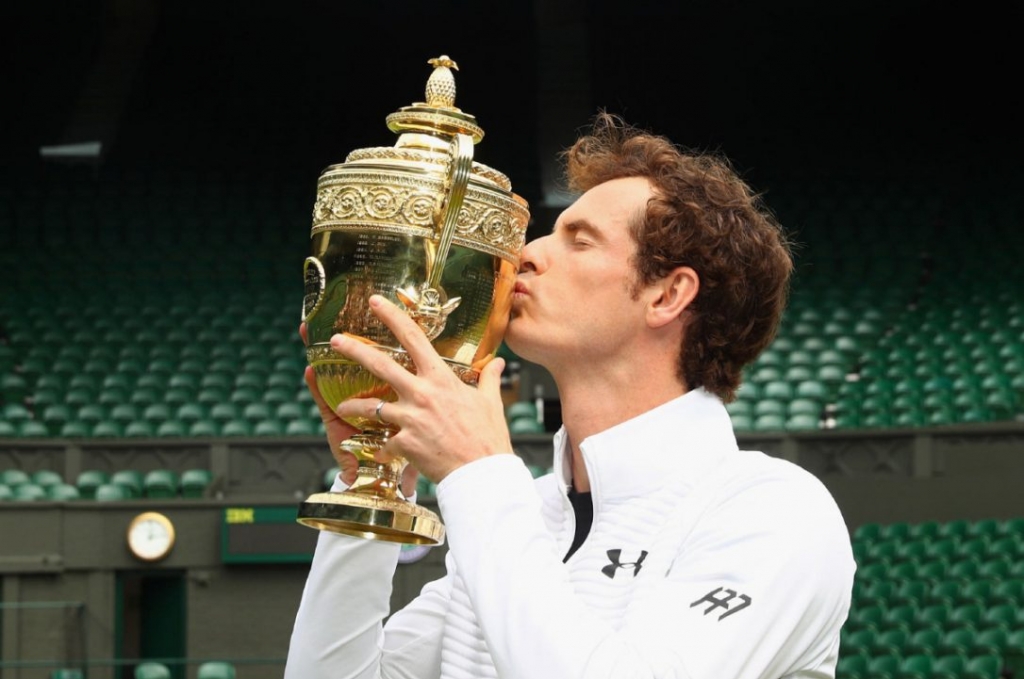 Andy Murray seen here kissing the trophy at Wimbledon will not play at the Rogers Cup this month