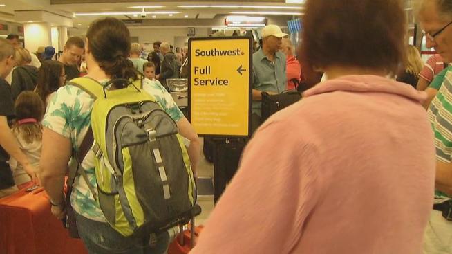 Southwest travelers urged to call ahead as delays continue following computer glitch