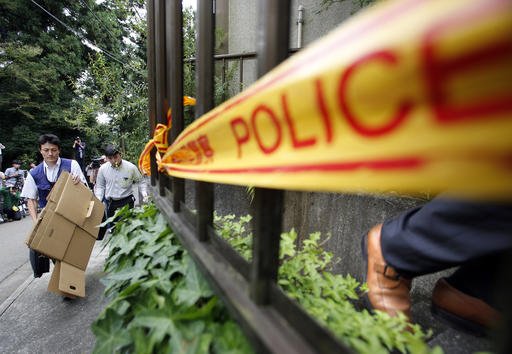 Police officers enter into the house of Satoshi Uematsu the suspect in a mass stabbing attack in Sagamihara outside of Tokyo Wednesday