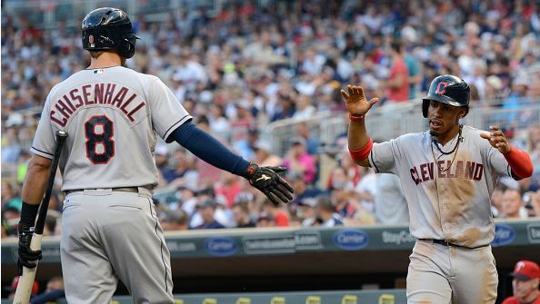 MINNEAPOLIS MN- JULY 15 Lonnie Chisenhall #8 of the Cleveland Indians congratulates teammate Francisco Lindor #12 on scoring a run against the Minnesota Twins during the fourth inning of the game