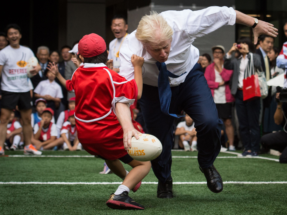 Boris Johnson named as Britain's new foreign secretary takes part in a 2015 street rugby tournament in Tokyo