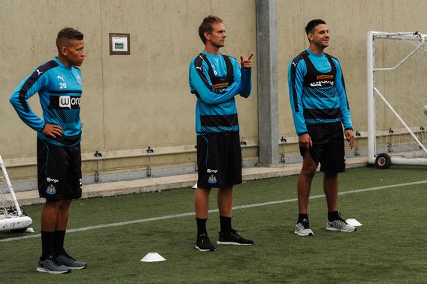 New signing Dwight Gayle Siem de Jong and Aleksandar Mitrovic speak with sports scientist Jamie Harley