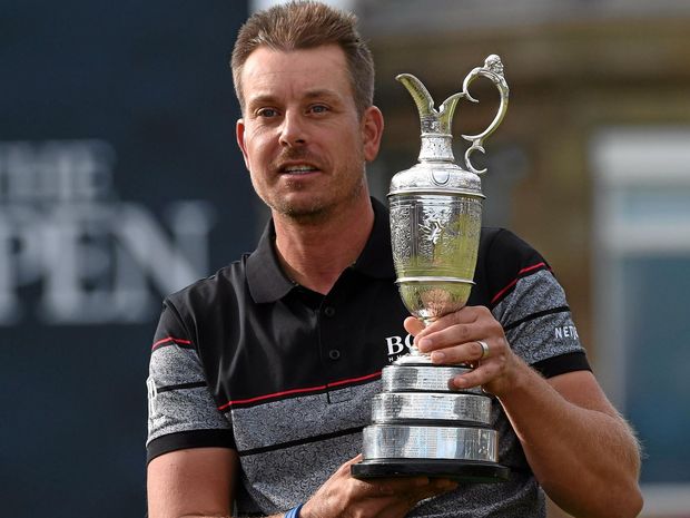 MAJOR BREAKTHROUGH Henrik Stenson of Sweden holds the Claret Jug for winning the British Open Golf Championship at Royal Troon in Scotland