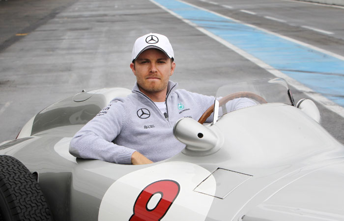 Formula 1 driver Nico Rosberg poses inside a historic Mercedes race car during the Hockenheim Ring Media Day at the race track in Hockenheim Germany Wednesday. — AFP