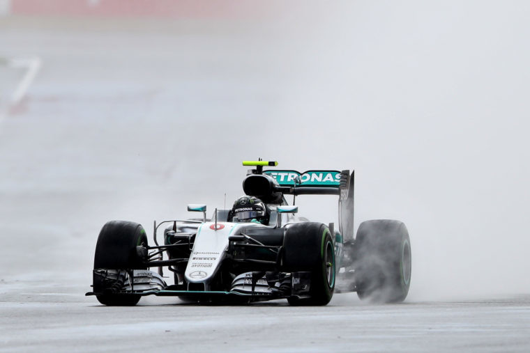 Nico Rosberg driving to second place subsequently demoted to third