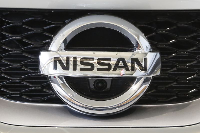 Nissan quarterly profit down 11 pct on yen, shrinking sales