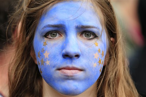 A'Remain supporter her face painted to resemble the EU flag walks on Park Lane in London as protesters marched to Parliament Square to show their support for the European Union in the wake of last weeks referendum decis