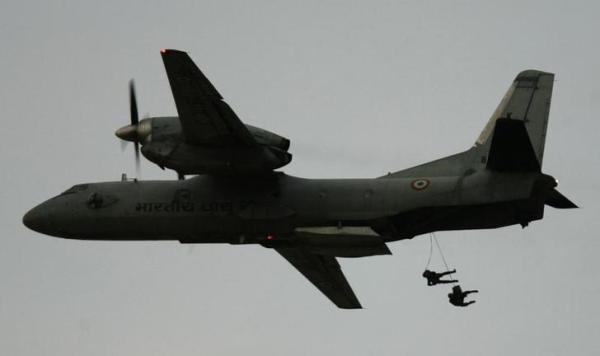 Paratroopers jump from an Indian Air Force AN-32 transport aircraft during the IAF 'Vayu Shakti 2010&#039, a day-dusk-night fire power demonstration at the air force field firing range of Pokhran in the desert Indian state of Rajasthan Februa