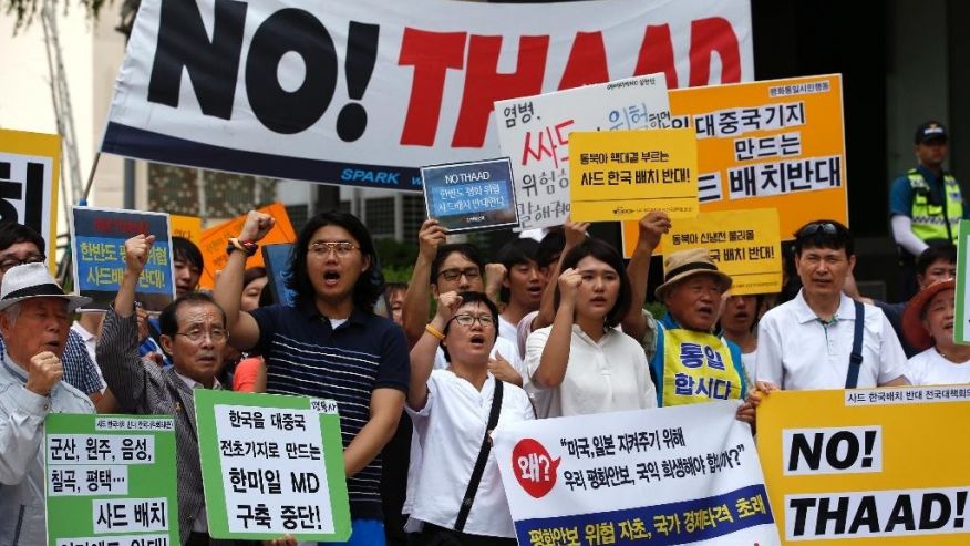 South Koreans shout slogans during a rally to denounce deploying the Terminal High Altitude Area Defense or THAAD near U.S. Embassy in Seoul South Korea Monday