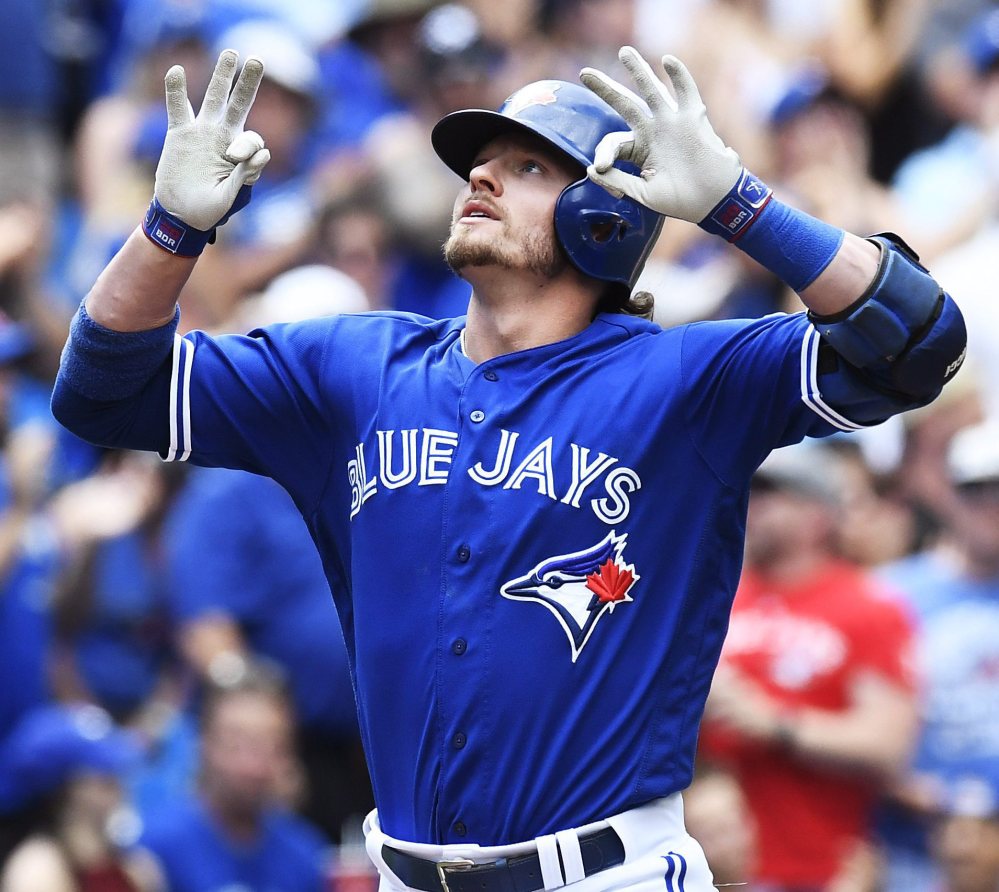 Josh Donaldson of the Blue Jays celebrates after hitting a tying solo home run during the seventh inning of a 9-6 win at home against Cleveland Saturday