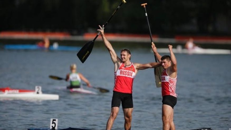 Nikolay Lipkin left and Andrey Kraitor of Russia celebrate after they won the C1 relay men 200m final of the ICF Canoe Sprint World Championships 2014 in Moscow Russia on Aug. 10 2014. The International Canoe Federation says it has barred five Russia