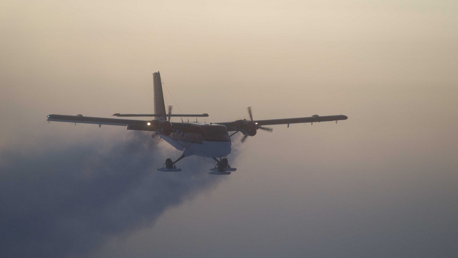 A Twin Otter plane flies out of the South Pole on a 2003 medical flight.       Credit    Jason Medley National Science Foundation