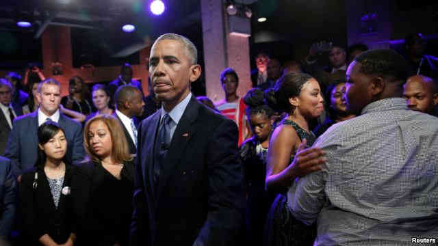 U.S. President Barack Obama meets members of the audience including Cameron Sterling, son of Alton Sterling who was shot and killed by white police officers in Baton Rouge after taking part in a televised town hall meeting