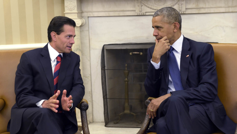 President Barack Obama right meets with Mexican President Enrique Pena Nieto left in the Oval Office of the White House in Washington Friday