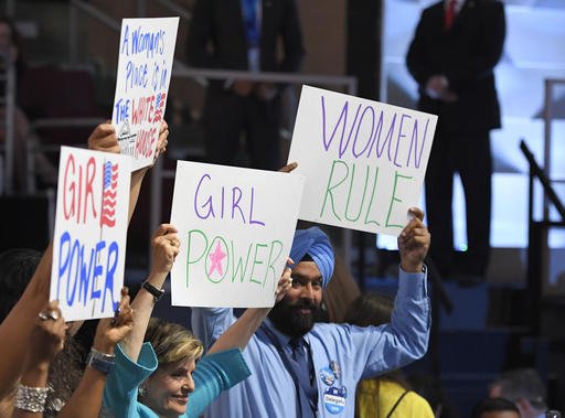 Supporters of Hillary Clinton hold signs during the third day of the Democratic National Convention in Philadelphia, Wednesday