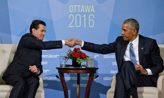 President Barack Obama shakes hands with Mexican President Enrique Pena Neito during their bilateral meeting at the National of Canada in Ottawa Canada. Hours after Donald Trump accepted the Rep