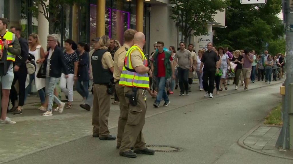 Officials evacuate large crowds from shooting scene in Munich Germany