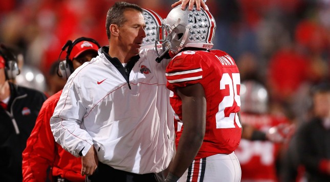 COLUMBUS OH- NOVEMBER 03 Head Coach Urban Meyer of the Ohio State Buckeyes congratulates Bri'onte Dunn #25 of the Ohio State Buckeyes after he scored a touchdown against the Illinois Illini