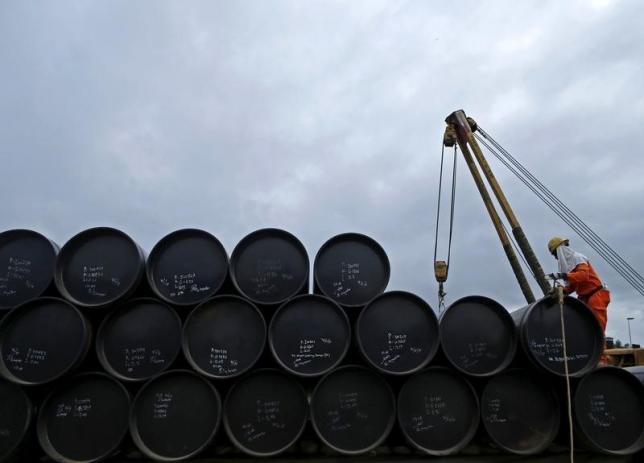 A worker prepares to transport oil pipelines to be laid for the Pengerang Gas Pipeline Project at an area 40km away from the Pengerang Integrated Petroleum Complex in Pengerang Johor