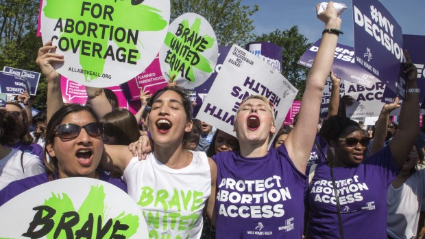 Abortion rights activists rejoice in front of the Supreme Court in Washington Monday