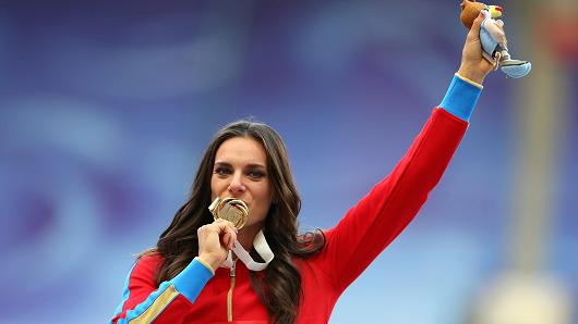 Gold medalist Yelena Isinbayeva of Russia poses on the podium during the medal ceremony for the Women's Pole Vault during day six of the 14th IAAF World Athletics Championships Moscow 2013