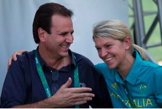 Rio de Janeiro's mayor Eduardo Paes left greets Australia's delegation head Kitty Chiller during a ceremony at the Olympic Village in Rio de Janeiro Brazil Wednesday