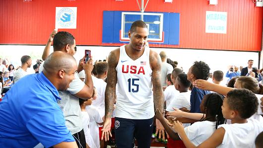 Carmelo Anthony #15 of the 2016 USA Men's Senior National Basketball Team shakes hands with some fans during a press conference at Dunleavy Milbank Center