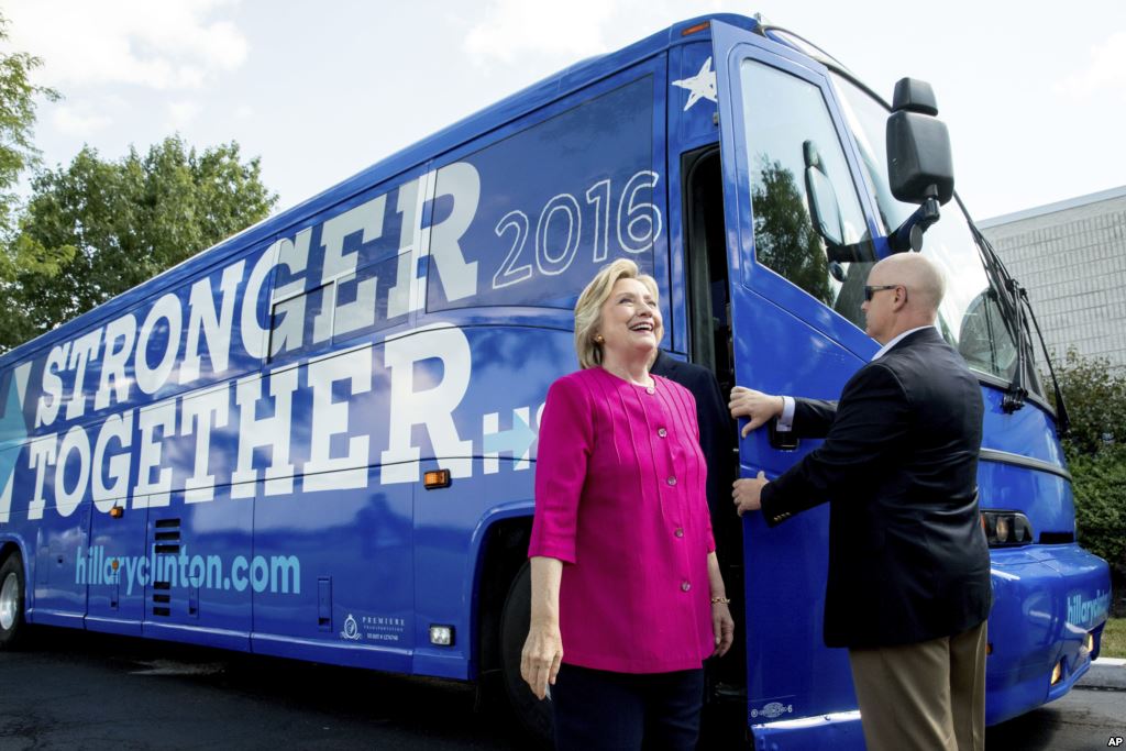 Democratic presidential candidate Hillary Clinton gets off her campaign bus as she arrives for a rally at K'NEX a toy company in Hatfield Pa