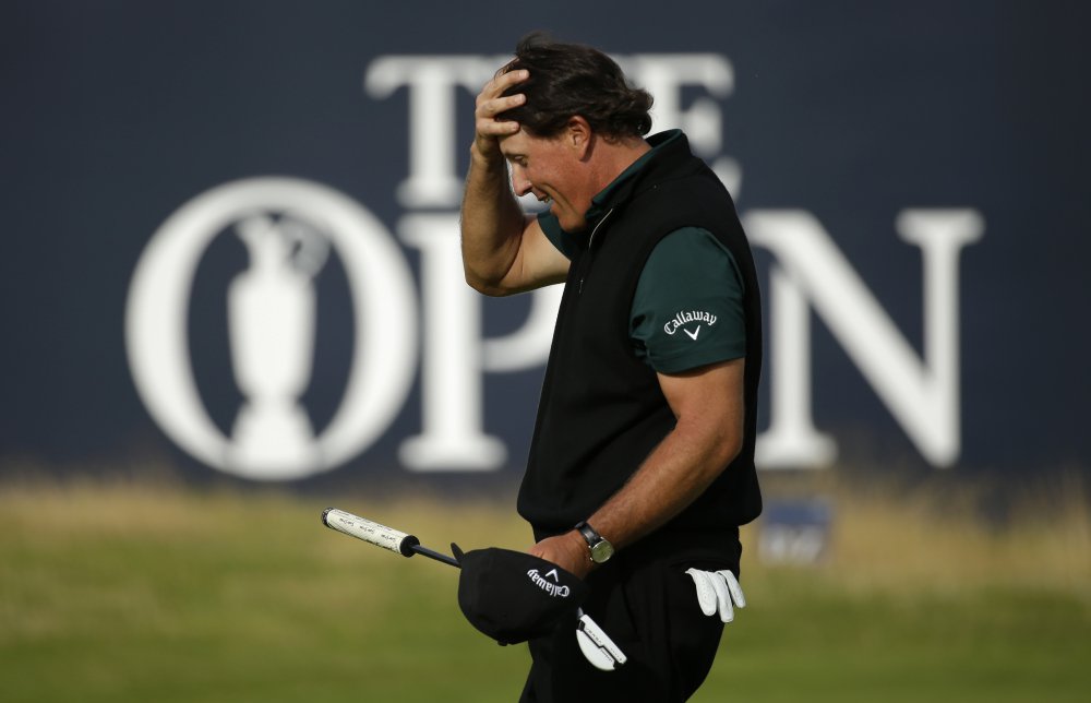 Phil Mickelson of the United States reacts after missing a birdie putt on the 18th green during the first round of the British Open at the Royal Troon Golf Club in Troon Scotland on Thursday