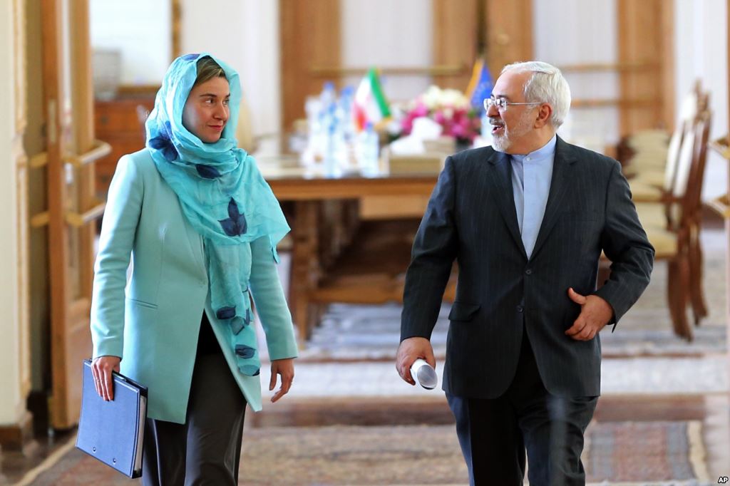 FILE- Iranian Foreign Minister Mohammad Javad Zarif and European Union foreign policy chief Federica Mogherini arrive to attend a press briefing after their meeting in Tehran Iran