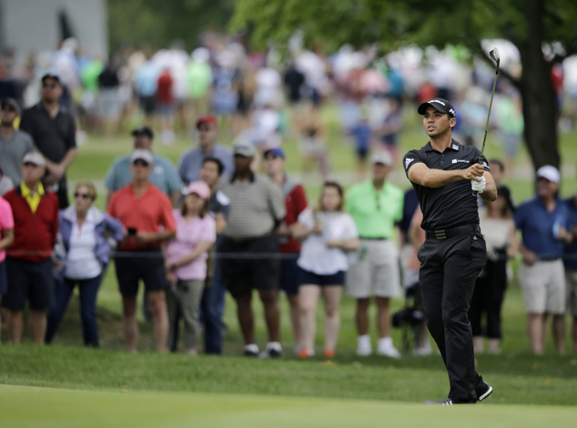 Jason Day from Australia hits to the second green during the third round of the Bridgestone Invitational golf tournament at Firestone Country Club Saturda