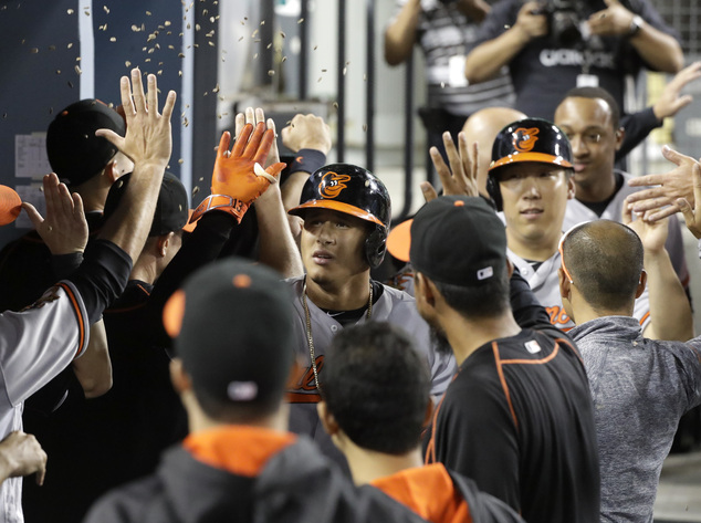 Baltimore Orioles Manny Machado right celebrates his three-run home run with Jonathan Schoop during the fifth inning of a baseball game against the Los An