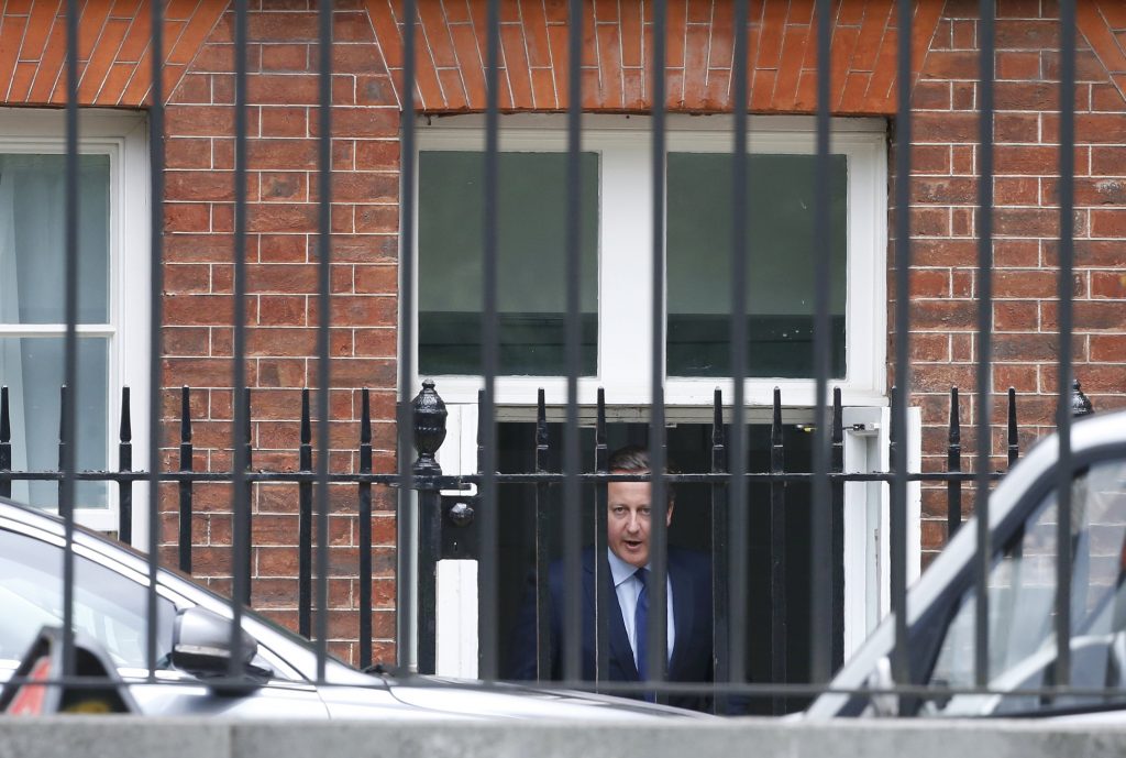 Britain's Prime Minister David Cameron leaves through a rear entrance after a cabinet meeting at number 10 Downing Street in central London Britain