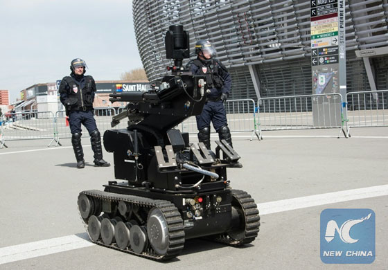 A bomb disposal robot is seen as policemen and rescuers take part in a mock terrorist attack exercise as part of the security measures set for the Euro 2016 football championship