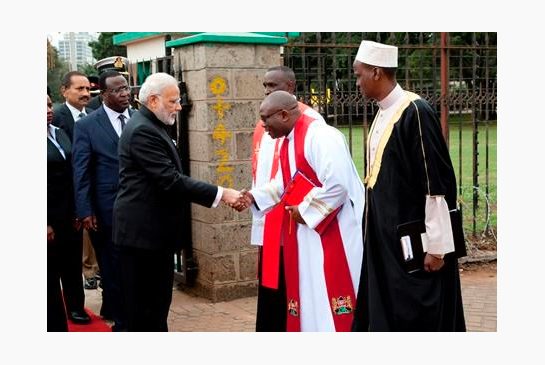 Indian Prime Minister Narendra Modi shakes hands with s religious leader after laying a wreath at the mausoleum of Kenyan founding President Mzee Jomo Kenyatta Monday