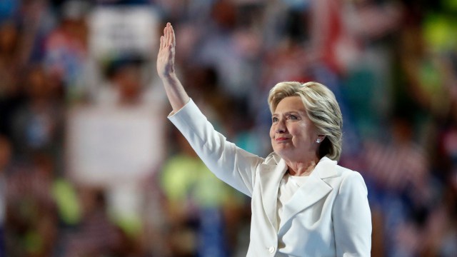 Democratic presidential nominee Hillary Clinton waves after taking the stage during the final day of the Democratic National Convention in Philadelphia, Thursday