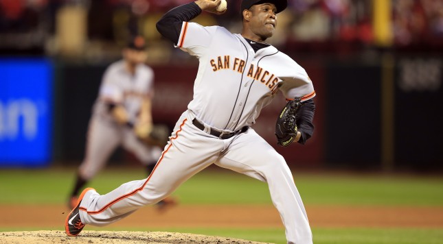 ST LOUIS MO- OCTOBER 11 Santiago Casilla #46 of the San Francisco Giants pitches against the St. Louis Cardinals during Game One of the National League Championship Series at Busch Stadium