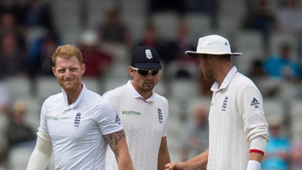 England's Ben Stokes reacts as he walks injured from the pitch on the fourth day of the second test cricket match between England and Pakistan at the Old Trafford Cricket Ground in Manchester northwest England