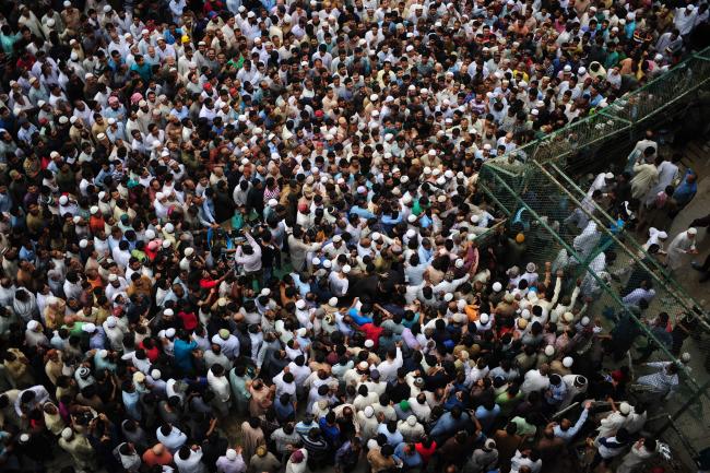 Pakistani mourners gather during the funeral ceremony of renowned social worker Abdul Sattar Edhi in Karachi Pakistan on Saturday. — AFP