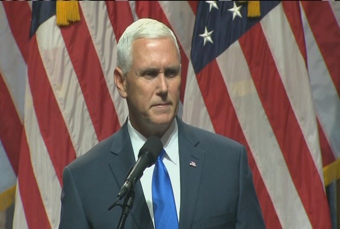 Pence standing alone in front of American flags formally accepted Trump's offer to join the GOP ticket at an event in New York