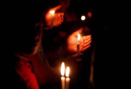 People attend a candle light vigil for the victims of the attack on the Holey Artisan Bakery and the O'Kitchen Restaurant in Dhaka Bangladesh